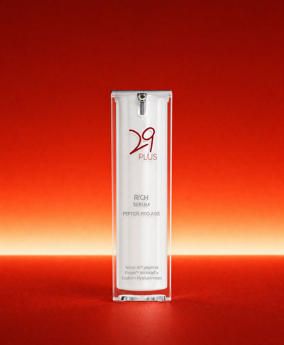 29 PLUS Rich Serum, a lightweight peptide serum bottle, on a red background